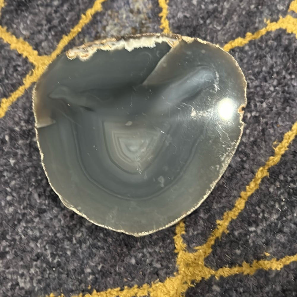 Agate Slice 4 1/2” 4 1/2” at Widest Points. Gray tones w/ White on 1 Edge.